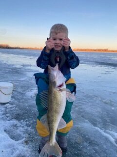 Congratulations Young Emerson Copenhaver catching his personal best walleye while fishing with his Grandpa Bill Zarahdka of Wolf Point