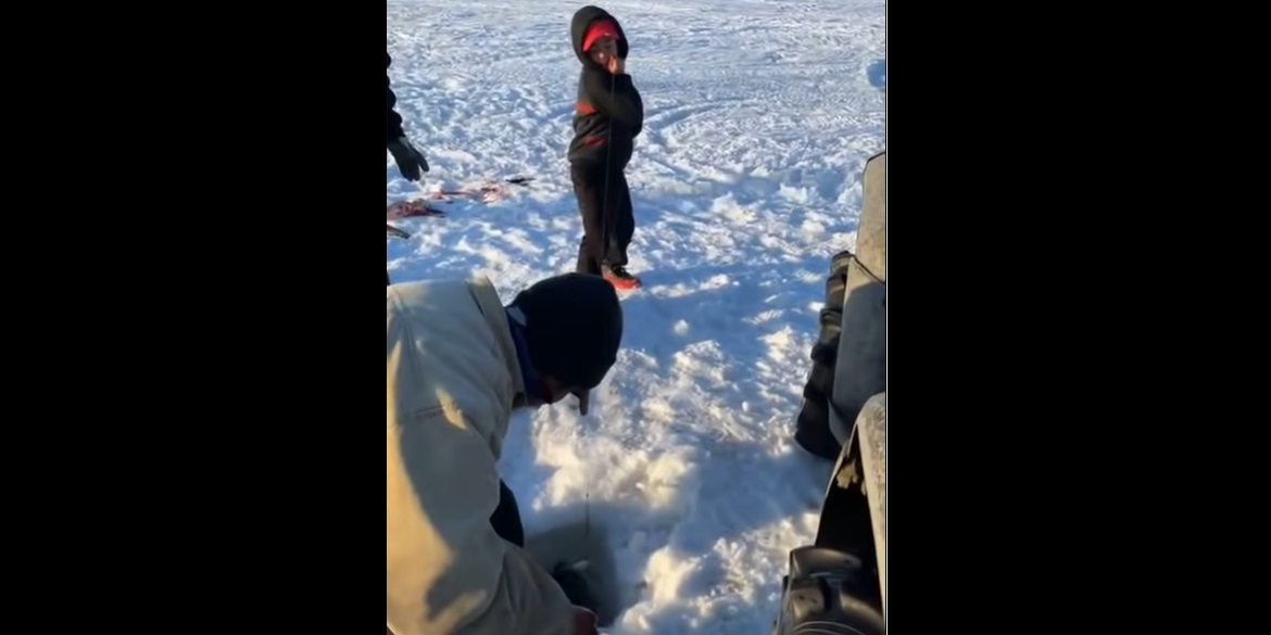 Ice Fishing Kid Reels In A Big One!